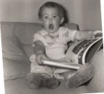 Age 1-1/2 years ... with a book, of course!